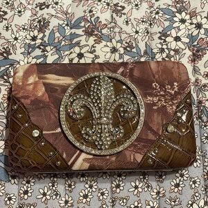 NWOT- clutch w/camo design w/white rhinestones &  snake design, push open lock.